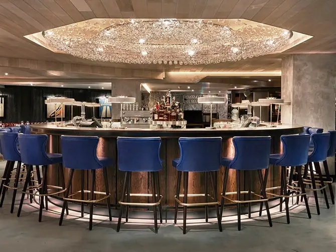 Image shows the large chandelier in the bar area of 100 Wardout Street D and D Restaurant after a lighting project.