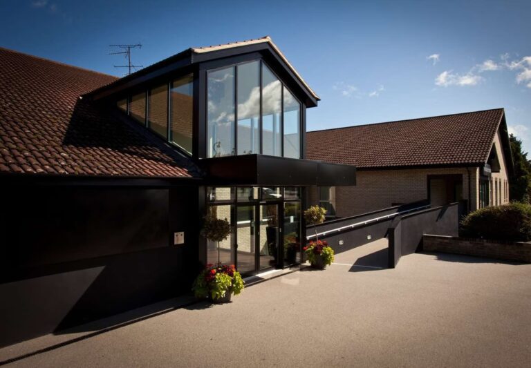 Bester Western Gloucester Robinswood front entrance after lighting project.