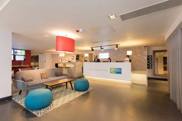 Image shows Holiday Inn Express Southwark reception area after upgrading lighting after lighting project.