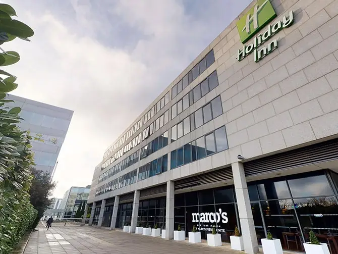 An image of the Holiday Inn Milton Keynes main entrance following completed lighting project by Lightsave Projects.