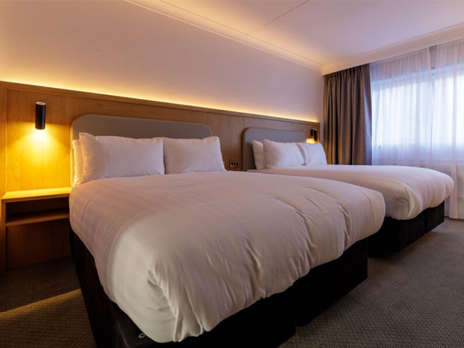 An image of Holiday Inn Edinburgh Zoo bedroom with improved LED lighting.