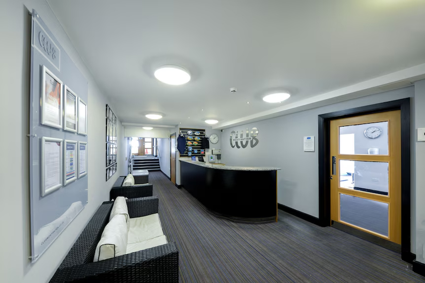 Crowne Plaza Plymouth gym reception area after lighting project completion.